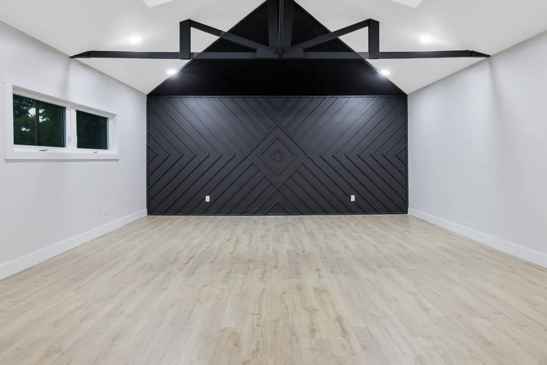 Living room: Vaulted ceiling with a custom accent wall